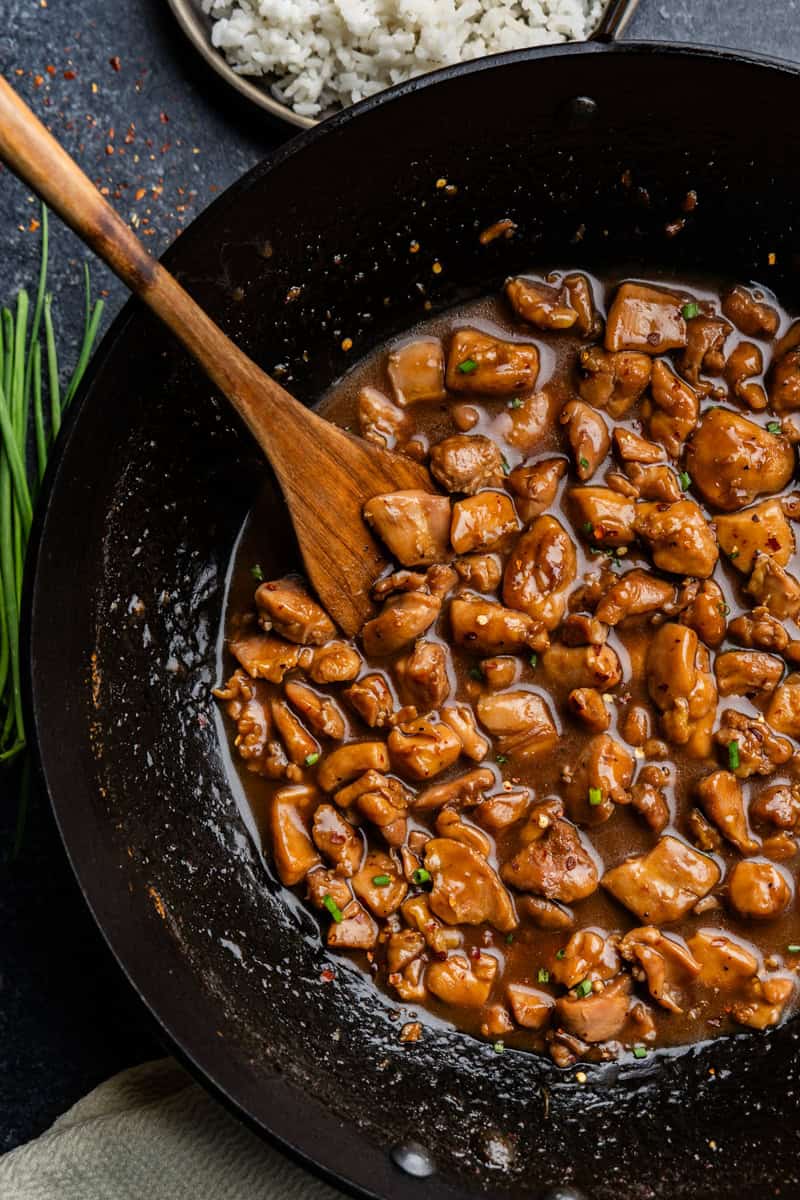 Overhead shot or bourbon chicken in skillet.