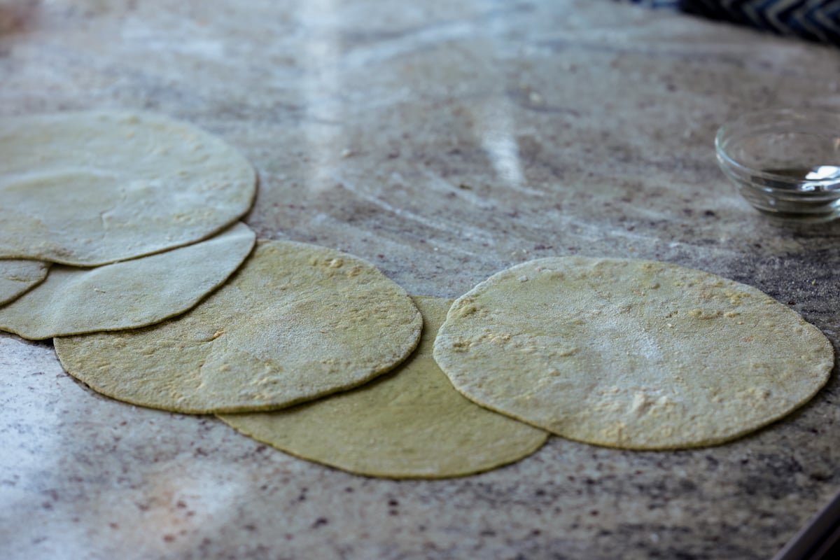 spinach paratha rolled out on the counter