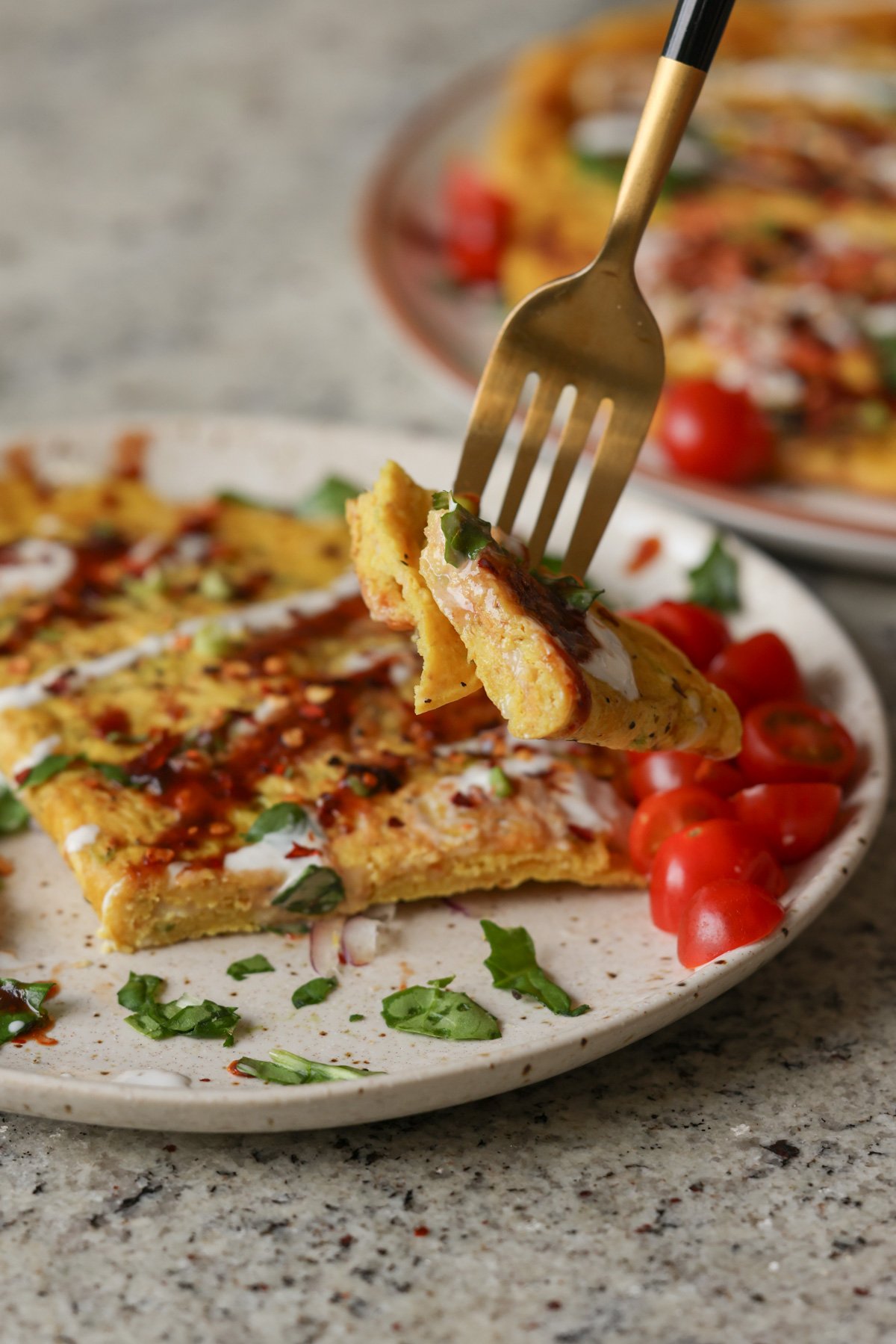 fork taking a bite of a vegan omelet
