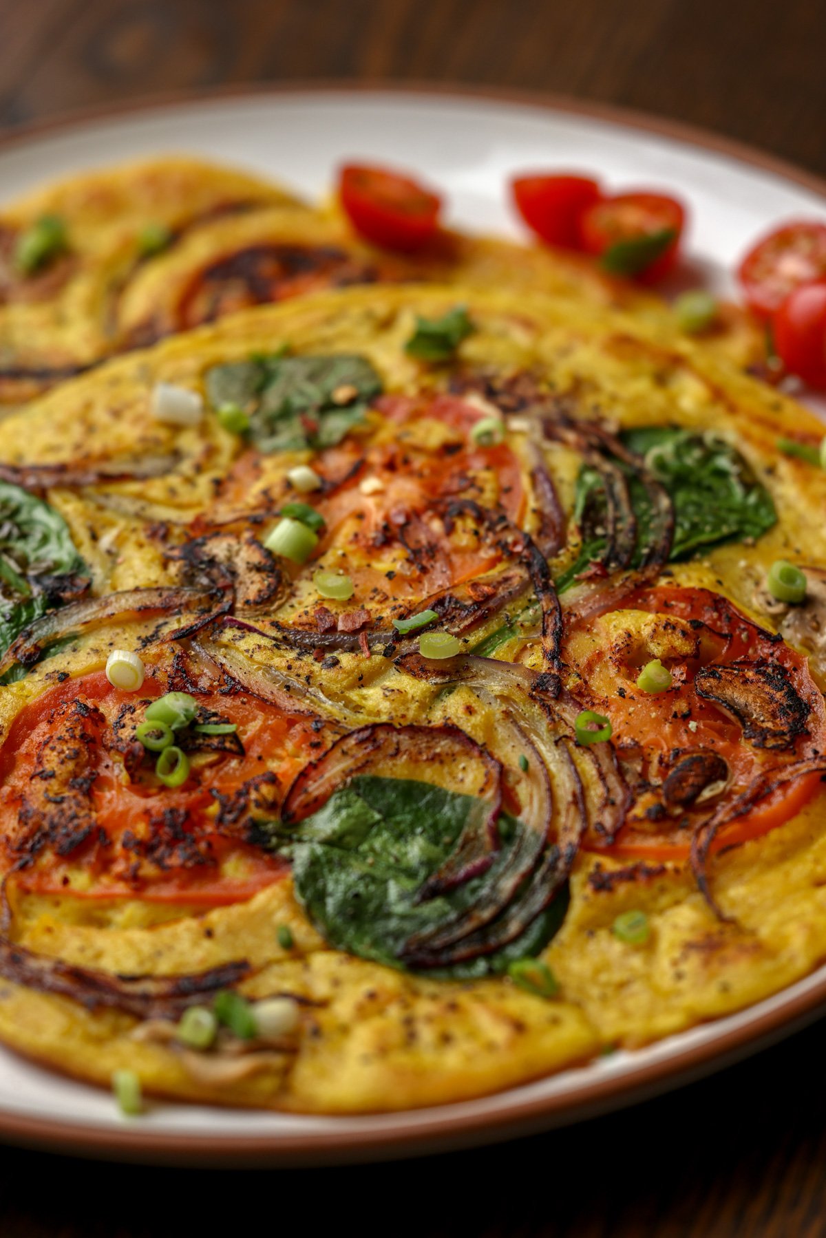 chickpea omelette prepared with the veggies inside