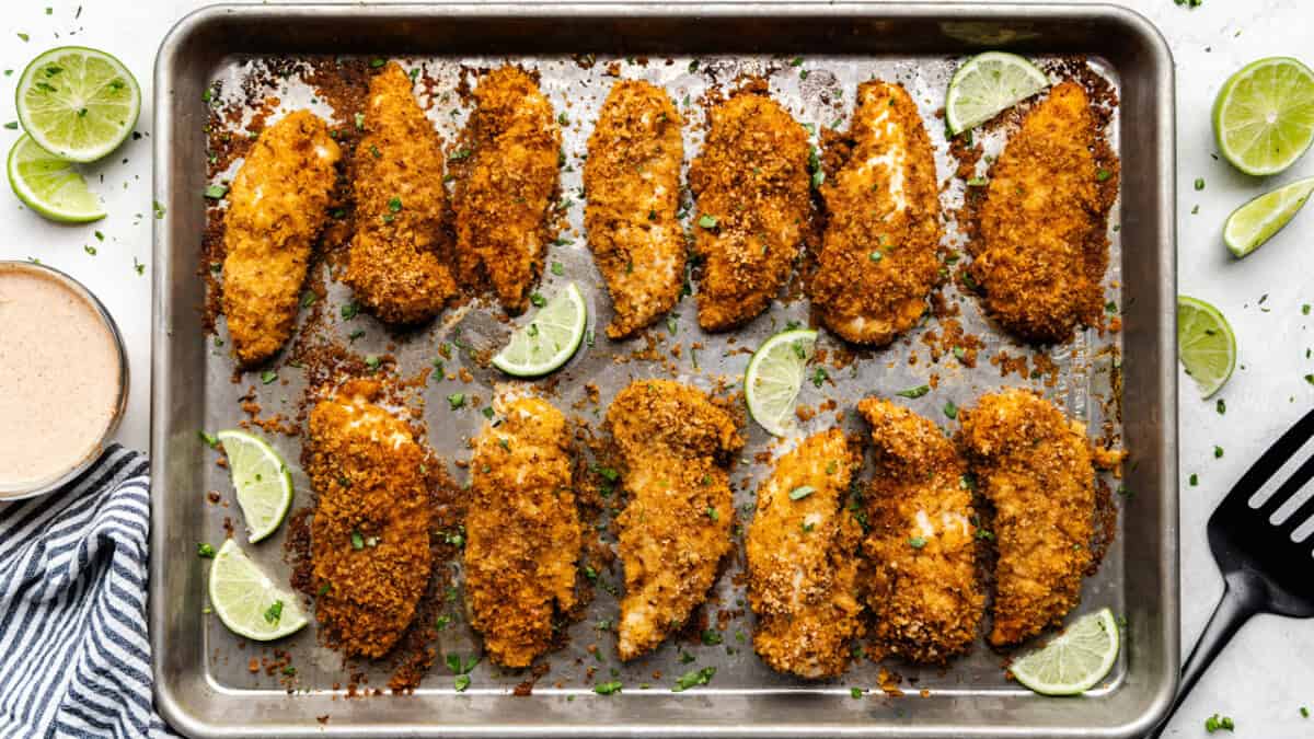 Chile-Lime Baked Chicken Tenders on a sheet pan.