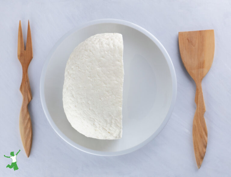 Easy Kefir Cheese | Healthy Home Economist homemade kefir cheese on white plate with wood utensils