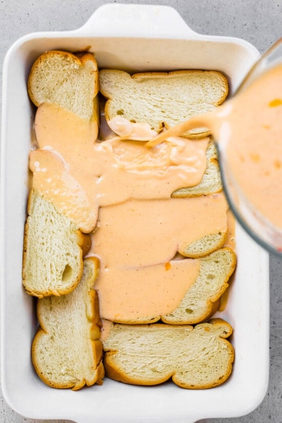 Pour egg over bread in baking dish