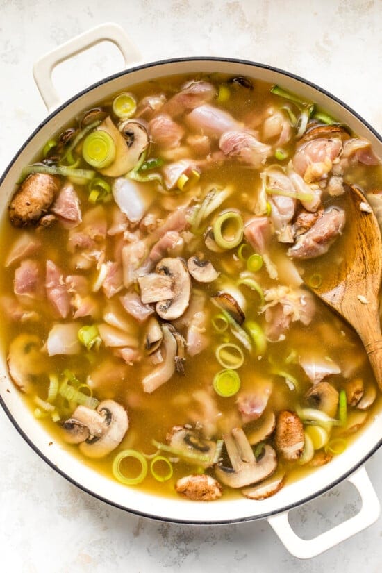 Add chicken and broth and simmer