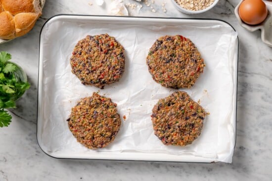 Black bean burgers shaped into patties.