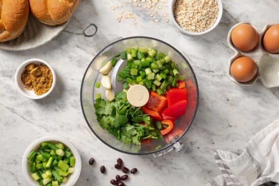 Veggies and cilantro in a food processor.