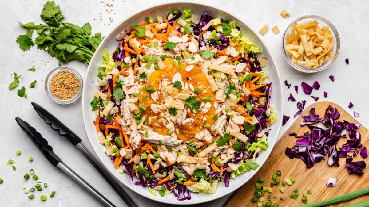 Overhead shot of Chinese Chicken Salad before it's been mixed in a large bowl.
