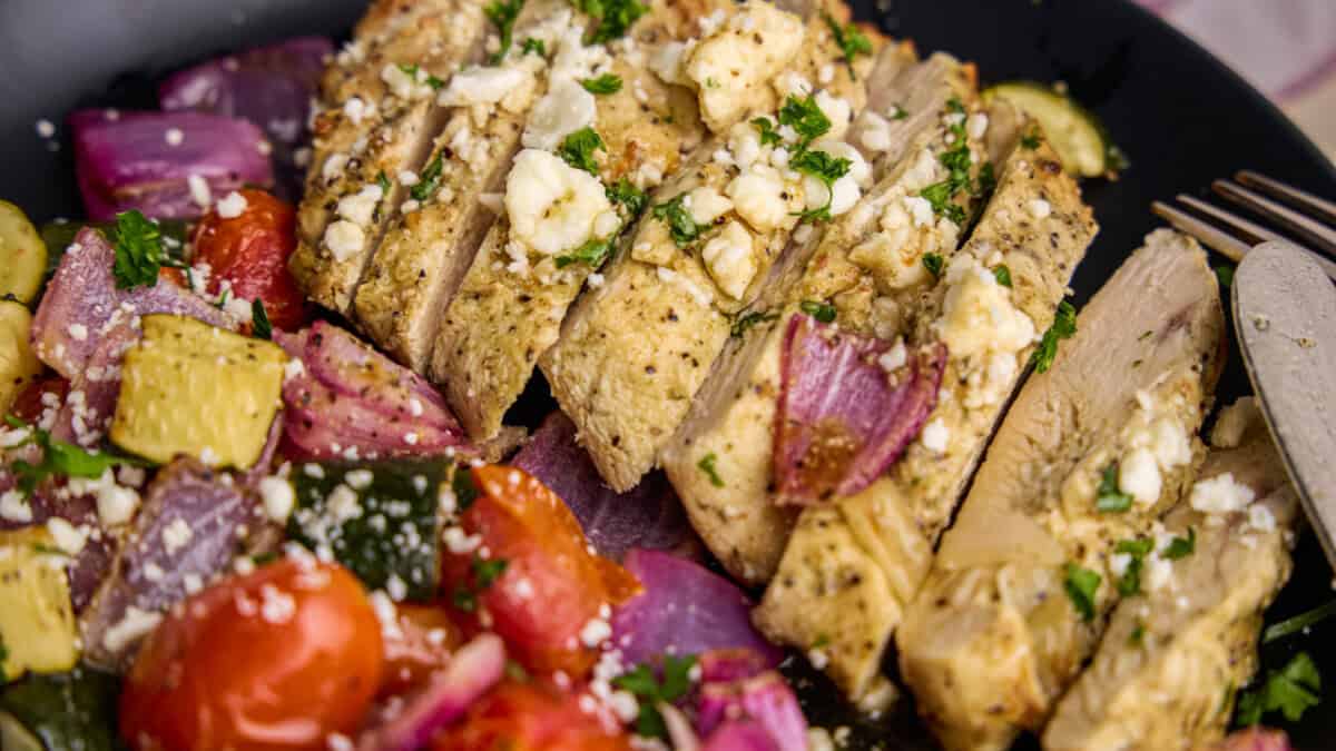 Close up of Air Fryer Greek Chicken & Veggies on a plate.