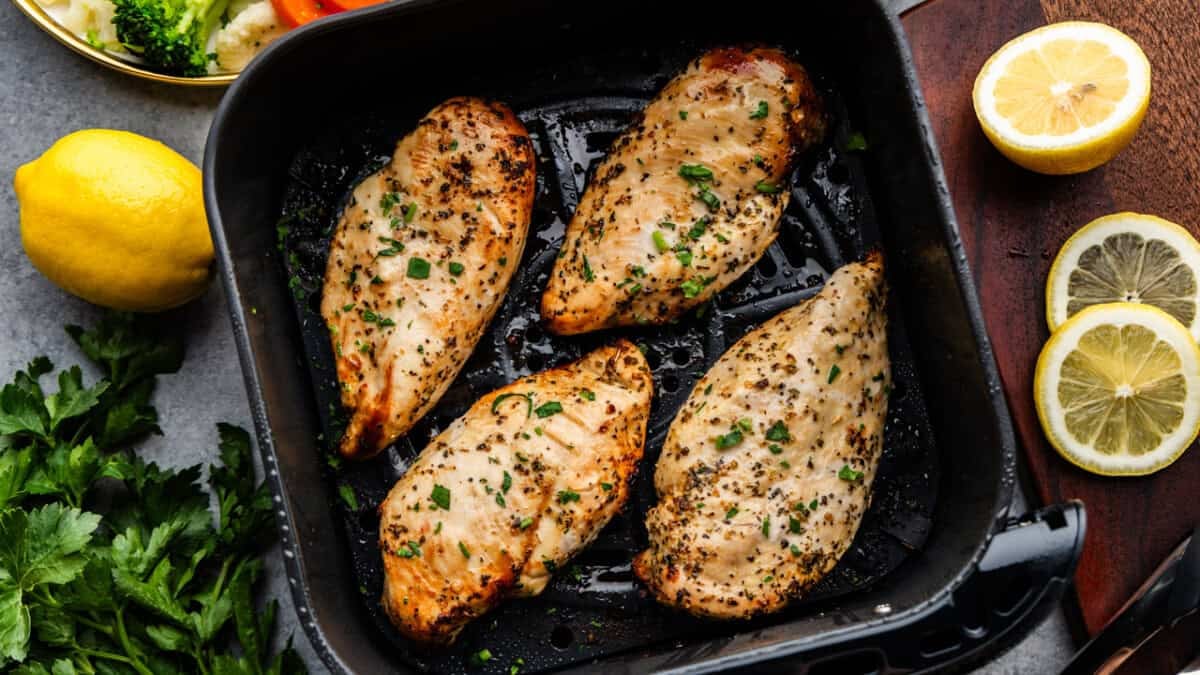 Overhead shot of Chicken breast in an air fryer.