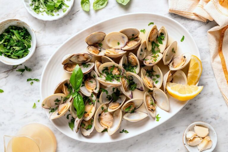 Platter of steamed clams with basil.