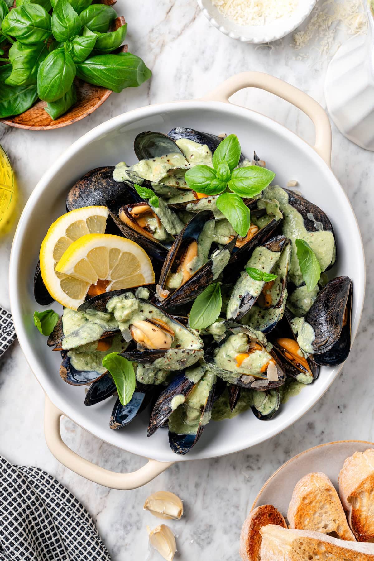 With tender mussels in cream sauce with Parmesan and basil, this recipe is perfect for special occasions, but easy enough for a weeknight! Mussels in cream sauce with basil and lemon.