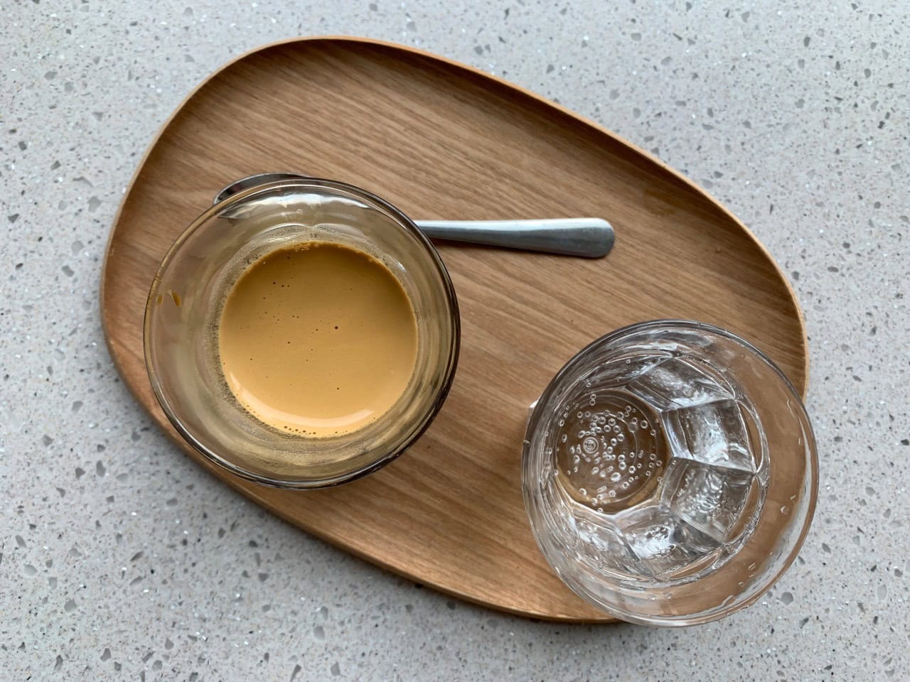 A shot of espresso on a tray