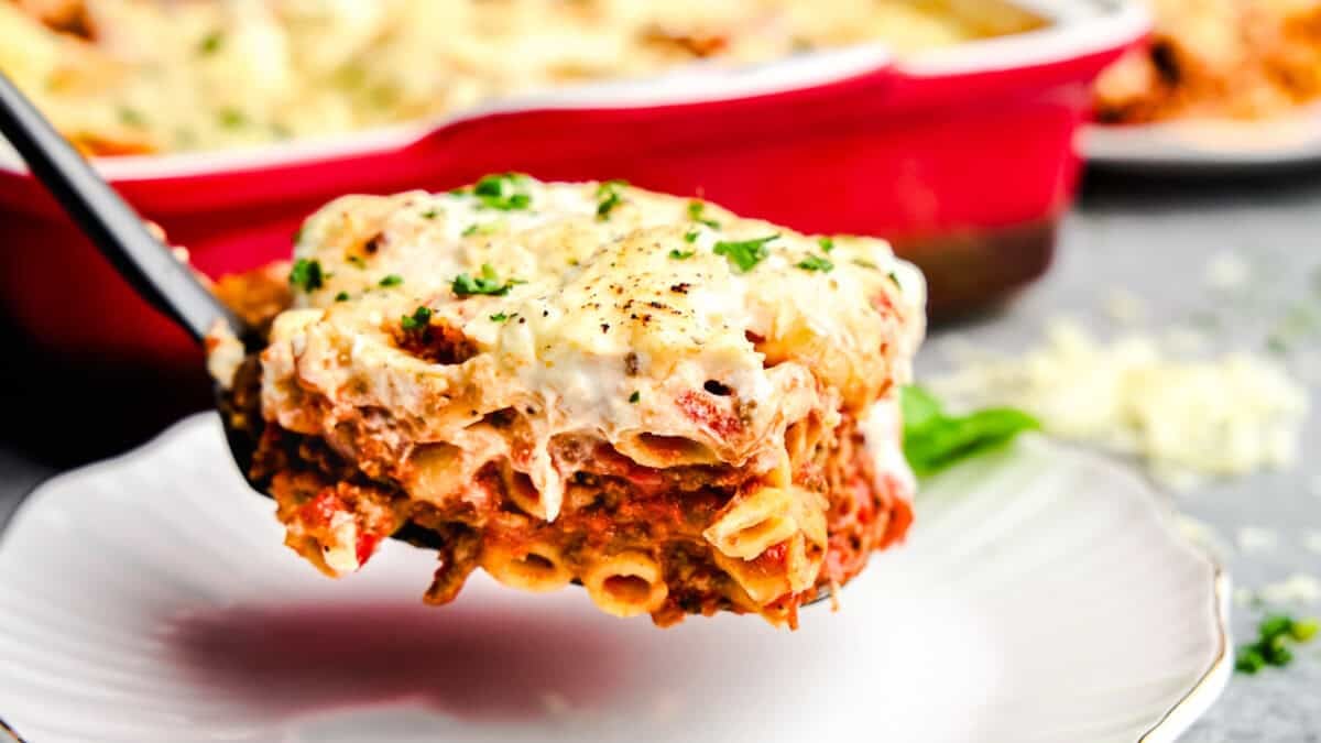 A Slice of the Best Baked Ziti Ever on a spatula.