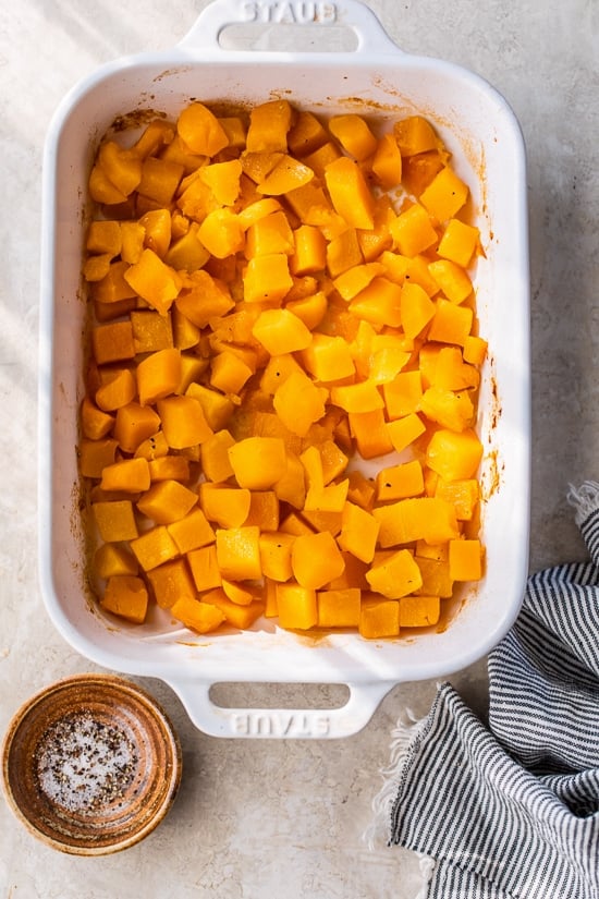 Maple roasted butternut squash in a casserole dish.