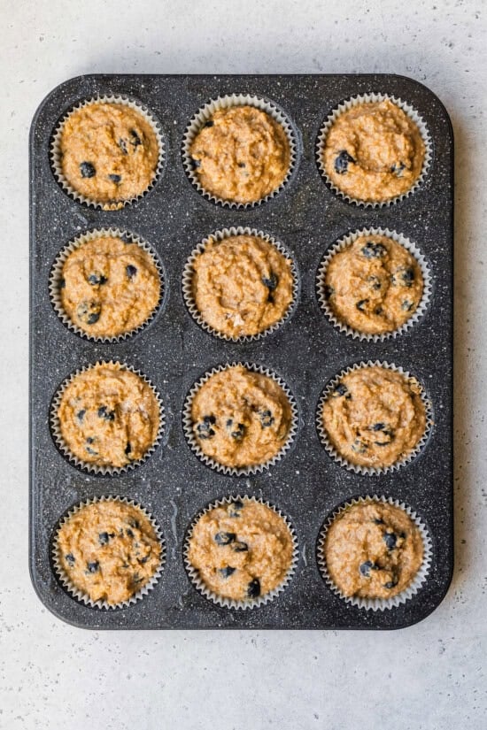 batter poured into a muffin tin